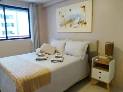 Uma cama ou camas num quarto em Beira Mar: Bom Gosto e Conforto