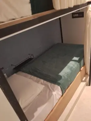 Uma cama ou camas num quarto em URB Hotel