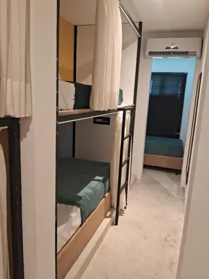 Uma cama ou camas num quarto em URB Hotel