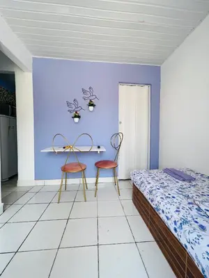 Uma cama ou camas num quarto em La casita lilás