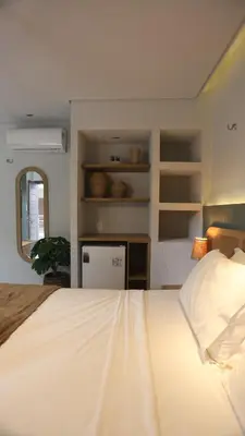 Uma cama ou camas num quarto em Movimento Suites