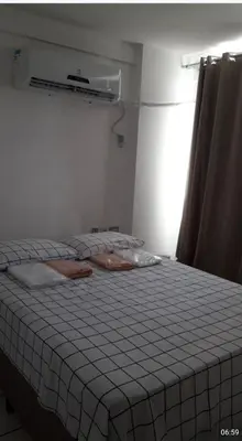 Uma cama ou camas num quarto em Apartamento por temporada
