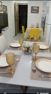 Uma televisão e/ou sistema de entretenimento em Apartamento por temporada
