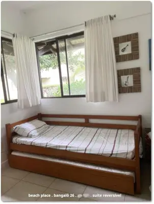 Uma cama ou camas num quarto em Beach Place Resort . ap térreo