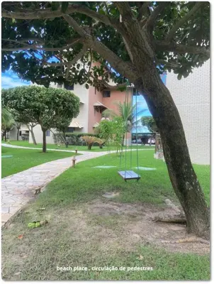 Um jardim no exterior de Beach Place Resort . ap térreo