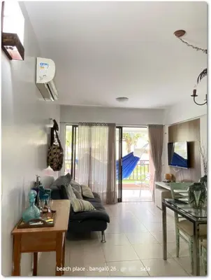 Uma área de estar em Beach Place Resort . ap térreo