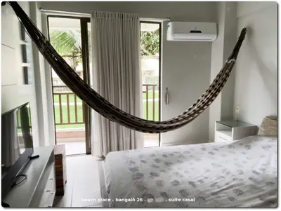 Uma cama ou camas num quarto em Beach Place Resort . ap térreo
