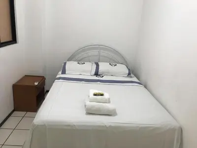 Uma cama ou camas num quarto em Apartamento Meireles