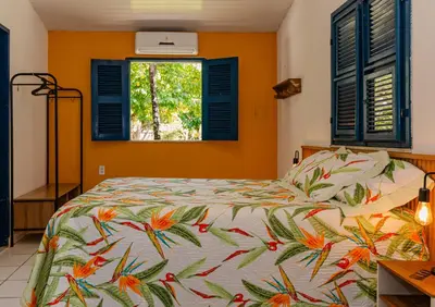 Uma cama ou camas num quarto em Éden do Catu