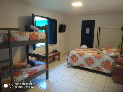 Uma cama ou camas num quarto em Éden do Catu