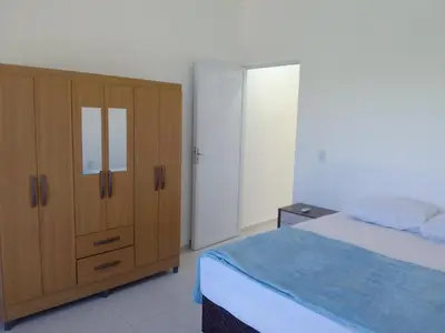 Uma cama ou camas num quarto em Apartamento Lua 3 - Quarto e Sala com Varanda e cozinha americana na praia do preá-Ce