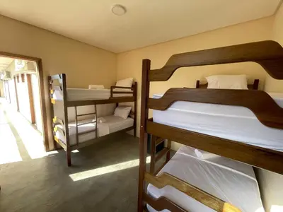 Uma cama ou camas num quarto em Pousada Veleiro Kite Preá