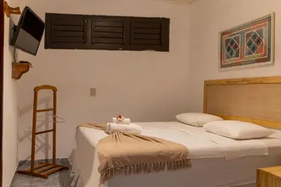 Uma cama ou camas num quarto em Pousada Chez Ellery Jeri