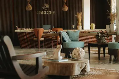 Uma área de estar em Carlore Hotel Taíba
