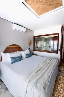 Uma cama ou camas num quarto em Carlore Hotel Taíba