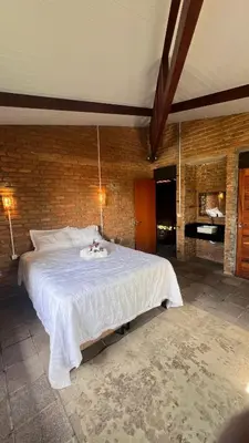 Uma cama ou camas num quarto em Casa Tijolinho - Barro Pret0, Aquiraz