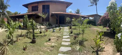 Um jardim no exterior de Casa Tijolinho - Barro Pret0, Aquiraz