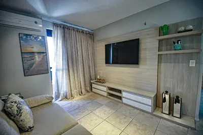 Uma televisão e/ou sistema de entretenimento em Flat Hotel Mercure Vista Mar