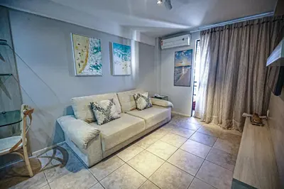 Uma área de estar em Flat Hotel Mercure Vista Mar