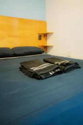 Uma cama ou camas num quarto em Pousada Catavento