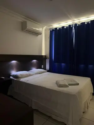 Uma cama ou camas num quarto em Hotel Sol Brasil