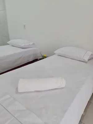 Uma cama ou camas num quarto em Pousada Jereissati