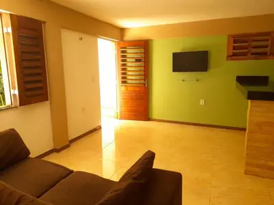 Uma televisão e/ou sistema de entretenimento em Casa Refúgio Familiar