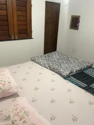 Uma cama ou camas num quarto em Casa Refúgio Familiar