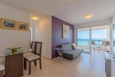 Uma área de estar em Beach Village #1503 - Apê na Praia por Carpediem