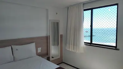 Uma cama ou camas num quarto em Familia VIP 4 Pessoas Praia de Iracema