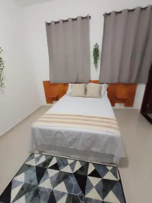 Uma cama ou camas num quarto em Central Palace Hotel
