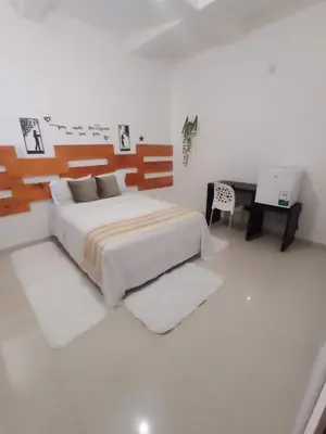 Uma cama ou camas num quarto em Central Palace Hotel