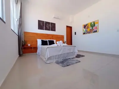 Uma cama ou camas num quarto em Central Palace Hotel