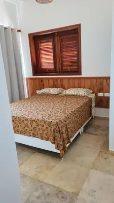 Uma cama ou camas num quarto em Villa Continentes Brasil & Maison de rêve sur la plage