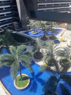 Um jardim no exterior de Lindo apartamento na Beira Mar Edifício Landscape