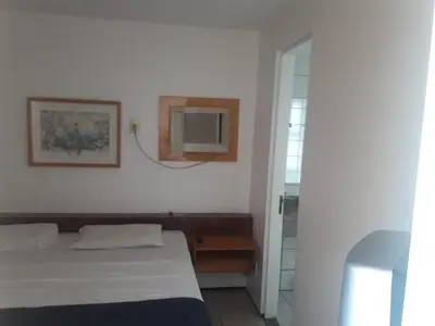 Uma cama ou camas num quarto em ApartHotel - Praia Mansa 1 e 2 Qtos
