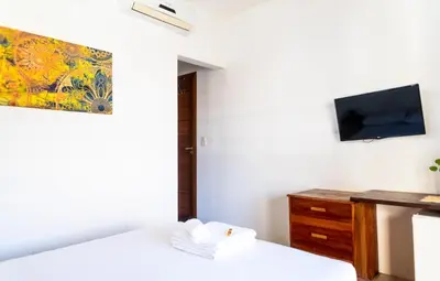 Uma televisão e/ou sistema de entretenimento em Pousada Meu Lugar