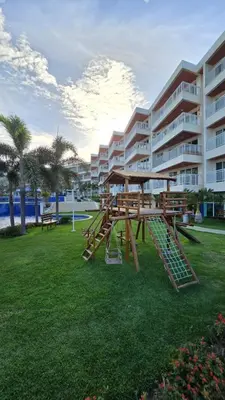 A área de jogos para crianças em Apartamento Confortável - Porto das Dunas - Perto do Beach Park