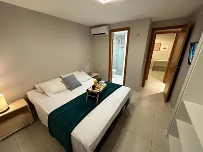 Uma cama ou camas num quarto em Porto Beach Conforto e Lazer a 200m do B Park