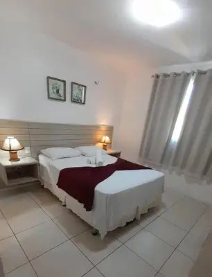 Uma cama ou camas num quarto em Porto Beach Conforto e Lazer a 200m do B Park
