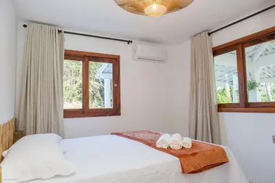 Uma cama ou camas num quarto em Casa Blue Parrot – Um Paraíso na Praia da Taíba