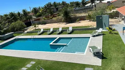 A piscina em ou perto de CHEZ TUPÃ SUÍTES