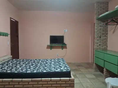 Uma televisão e/ou sistema de entretenimento em Flat Casa Taíba 2003
