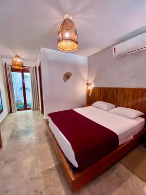 Uma cama ou camas num quarto em Casa Pitanga Flat