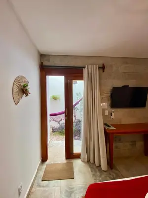 Uma televisão e/ou sistema de entretenimento em Casa Pitanga Flat