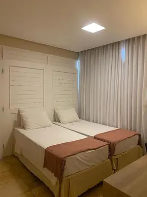 Uma cama ou camas num quarto em Pousada Tropical Ilhas