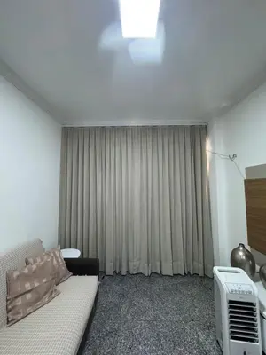 Uma área de estar em Newlife Residence