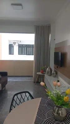 Uma área de estar em Newlife Residence