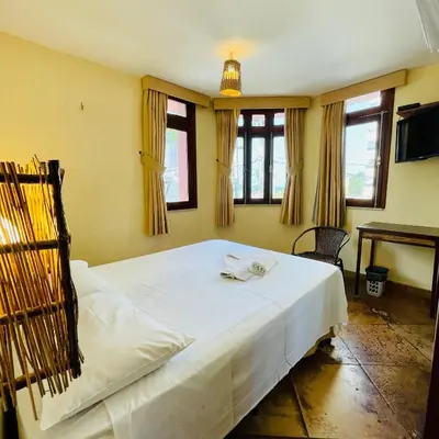 Uma cama ou camas num quarto em Pousada Fortal Villa Praia