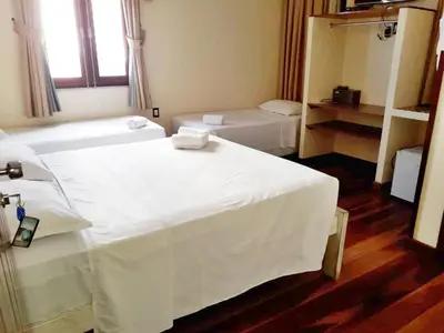 Uma cama ou camas num quarto em Pousada Fortal Villa Praia